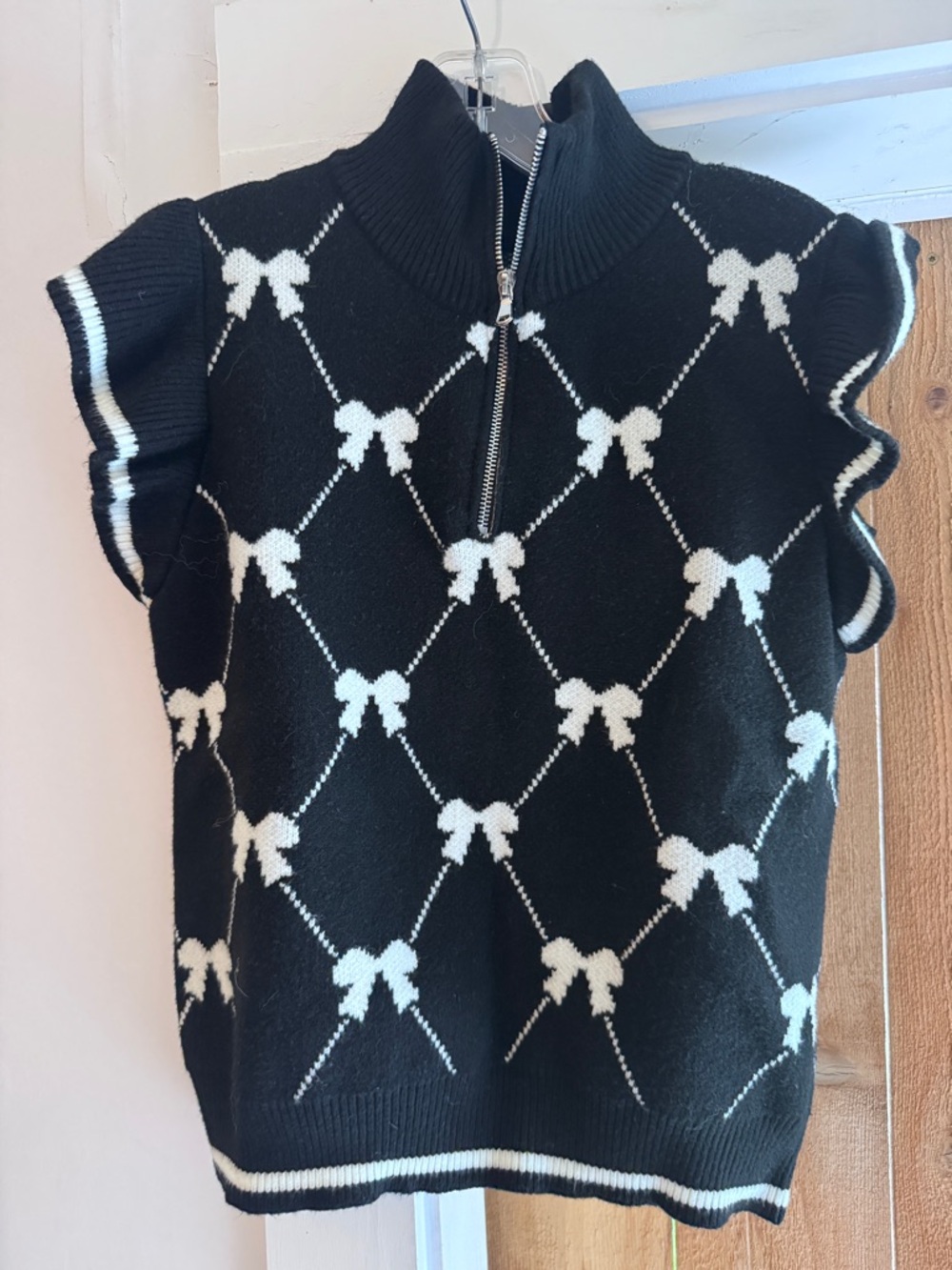 Incredibly Soft Zip-Neck Sleeveless Sweater with White Bow Pattern